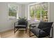 Comfortable sitting area with two stylish chairs and natural light from the surrounding windows at 109 Gerideau St, Walterboro, SC 29488