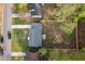 Aerial view of a home showing the roof, surrounding greenery, large backyard, and nearby street at 109 Sawmill Dr, Summerville, SC 29483