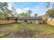 Large backyard with a new wooden fence with access to the home's exterior at 109 Sawmill Dr, Summerville, SC 29483