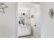 Charming bathroom with a white vanity, updated lighting and tile floors at 109 Sawmill Dr, Summerville, SC 29483