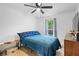 This stylish bedroom has a ceiling fan and a view of the backyard at 109 Sawmill Dr, Summerville, SC 29483