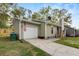Exterior angle of the house with a garage and front entrance, plus a view of the surrounding neighborhood at 109 Sawmill Dr, Summerville, SC 29483