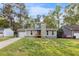 Charming ranch-style home boasts a quaint front porch, a cozy chimney, and a manicured lawn at 109 Sawmill Dr, Summerville, SC 29483