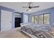 Bedroom features two windows, ceiling fan, and television at 1120 Hidden Cove Dr # I, Mount Pleasant, SC 29464