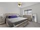 Well-lit bedroom features a modern bed frame, a ceiling fan, and matching nightstands with a window view at 1120 Hidden Cove Dr # I, Mount Pleasant, SC 29464