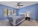 Bedroom features a ceiling fan, window with blinds, and comfortable bed with side table at 1120 Hidden Cove Dr # I, Mount Pleasant, SC 29464