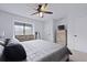 Bright bedroom with large window, dresser, ceiling fan, and neutral decor creating a peaceful space at 1120 Hidden Cove Dr # I, Mount Pleasant, SC 29464