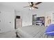 Spacious bedroom includes a ceiling fan, dresser, and built in bookcase next to the stairs at 1120 Hidden Cove Dr # I, Mount Pleasant, SC 29464