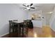 Dining room features wood flooring, an overhead fan and a pass through to the kitchen at 1120 Hidden Cove Dr # I, Mount Pleasant, SC 29464