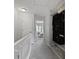 Hallway features carpeted floor, open shelving, and a door to the bedroom at 1120 Hidden Cove Dr # I, Mount Pleasant, SC 29464