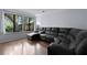 Bright living room featuring hardwood floors, large windows, and comfortable seating area at 1120 Hidden Cove Dr # I, Mount Pleasant, SC 29464