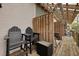 Outdoor patio with two chairs, storage box and a wooden privacy fence, offering a relaxing retreat at 1120 Hidden Cove Dr # I, Mount Pleasant, SC 29464