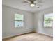 Bright bedroom featuring neutral decor, wood floors, and large windows for ample natural light at 1133 Mount Batten Dr, Hanahan, SC 29410