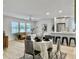 Charming dining area with a view of the living room, kitchen, and natural light at 1133 Mount Batten Dr, Hanahan, SC 29410