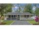 Charming single-story home with a welcoming front porch and neatly landscaped front yard at 1133 Mount Batten Dr, Hanahan, SC 29410