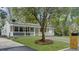 Inviting home exterior featuring a well-maintained lawn, attractive landscaping, and a cozy front porch at 1133 Mount Batten Dr, Hanahan, SC 29410
