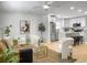 Bright living room features a modern design with a ceiling fan, plush seating, and a seamless view into the kitchen at 1133 Mount Batten Dr, Hanahan, SC 29410