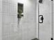 Modern shower featuring white subway tiles, a plant in the inset shelf, and sleek black hardware at 1133 Mount Batten Dr, Hanahan, SC 29410