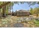 Exterior view of home's backyard with mature trees and a bench at 115 Foxborough Rd, Goose Creek, SC 29445