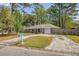 Single story home with brick exterior, a driveway, and mailbox at 115 Foxborough Rd, Goose Creek, SC 29445