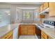 Kitchen boasts tile countertops, cabinets, and stainless steel appliances at 115 Foxborough Rd, Goose Creek, SC 29445