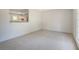 View from the living room into the kitchen with lots of natural light at 115 Foxborough Rd, Goose Creek, SC 29445