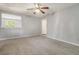 Living room with neutral walls, carpet, ceiling fan, and view to another room at 115 Foxborough Rd, Goose Creek, SC 29445