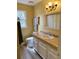 Bright bathroom featuring decorative window, modern vanity, and neutral color scheme at 1291 Old Colony Rd, Mount Pleasant, SC 29464