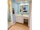 Bathroom with bright blue walls and a large mirror above a vanity at 1291 Old Colony Rd, Mount Pleasant, SC 29464