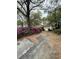Inviting single-story home with a garage and a driveway surrounded by colorful azaleas at 1291 Old Colony Rd, Mount Pleasant, SC 29464