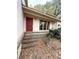 Front entrance with a red door and brick steps on the outside at 1291 Old Colony Rd, Mount Pleasant, SC 29464