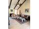 Cozy living room boasts beamed vaulted ceiling, fireplace and plenty of natural light at 1291 Old Colony Rd, Mount Pleasant, SC 29464