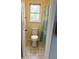 Bright toilet room with a view from the window and a green shower curtain at 1291 Old Colony Rd, Mount Pleasant, SC 29464