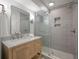 Modern bathroom featuring a marble vanity top and gray tiled shower with glass door at 1330 Sea Elder Dr # C, Kiawah Island, SC 29455