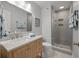 Bathroom with tile flooring, wood vanity with marble countertop, and a glass shower at 1330 Sea Elder Dr # C, Kiawah Island, SC 29455