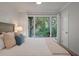 Comfortable bedroom featuring a view of lush landscaping and natural light at 1330 Sea Elder Dr # C, Kiawah Island, SC 29455