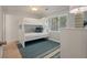 Bedroom with bunk beds, large windows, and a relaxing atmosphere at 1330 Sea Elder Dr # C, Kiawah Island, SC 29455