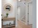 Charming entryway with stylish console table, decorative mirror, and staircase access at 1330 Sea Elder Dr # C, Kiawah Island, SC 29455