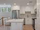 Bright, modern kitchen features white cabinets, stainless steel appliances, and an island at 1330 Sea Elder Dr # C, Kiawah Island, SC 29455