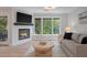 Cozy living room features a fireplace, natural light, comfortable seating, and an open floor plan at 1330 Sea Elder Dr # C, Kiawah Island, SC 29455