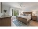 Cozy main bedroom with large windows overlooking lush greenery at 1330 Sea Elder Dr # C, Kiawah Island, SC 29455