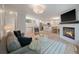 Spacious living area with a fireplace, modern furnishings, and an open layout connected to the kitchen at 1330 Sea Elder Dr # E, Kiawah Island, SC 29455