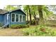 Back of the home with a sunroom extension and nicely landscaped yard at 1438 Arrow Wind Ter, Charleston, SC 29414