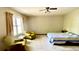 Spacious bedroom featuring natural light and two comfortable chairs at 1438 Arrow Wind Ter, Charleston, SC 29414