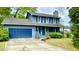Charming two-story home with a welcoming front porch, garage and beautiful blue siding at 1438 Arrow Wind Ter, Charleston, SC 29414