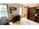Office features a desk, shelving unit, and natural light, creating a perfect work environment at 1438 Arrow Wind Ter, Charleston, SC 29414