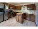 Functional kitchen with stainless steel refrigerator and wooden cabinetry at 1438 Arrow Wind Ter, Charleston, SC 29414
