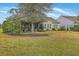 Charming home featuring a relaxing screened porch and spacious, well-maintained backyard, perfect for outdoor enjoyment at 145 Billowing Sails St, Summerville, SC 29486