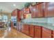 Elegant kitchen showcasing granite countertops, stainless steel appliances, and rich wood cabinetry at 145 Billowing Sails St, Summerville, SC 29486