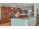 Well-equipped kitchen featuring granite countertops, stainless steel appliances, and ample cabinet space at 145 Billowing Sails St, Summerville, SC 29486